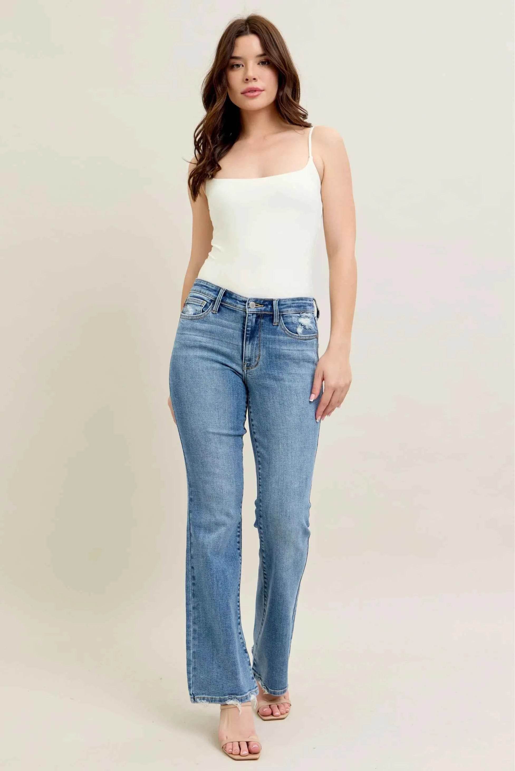Judy Blue Plus Size Mid Rise Bootcut Jeans with Destroyed Hem.