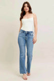 Judy Blue Plus Size Mid Rise Bootcut Jeans with Destroyed Hem.