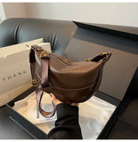 Stylish Leather Shoulder Bag with Woven Strap.