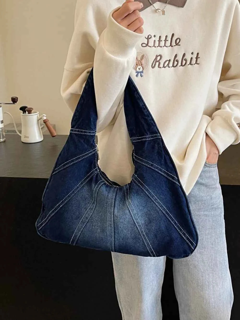 Crescent Shaped Denim Shoulder Bag.