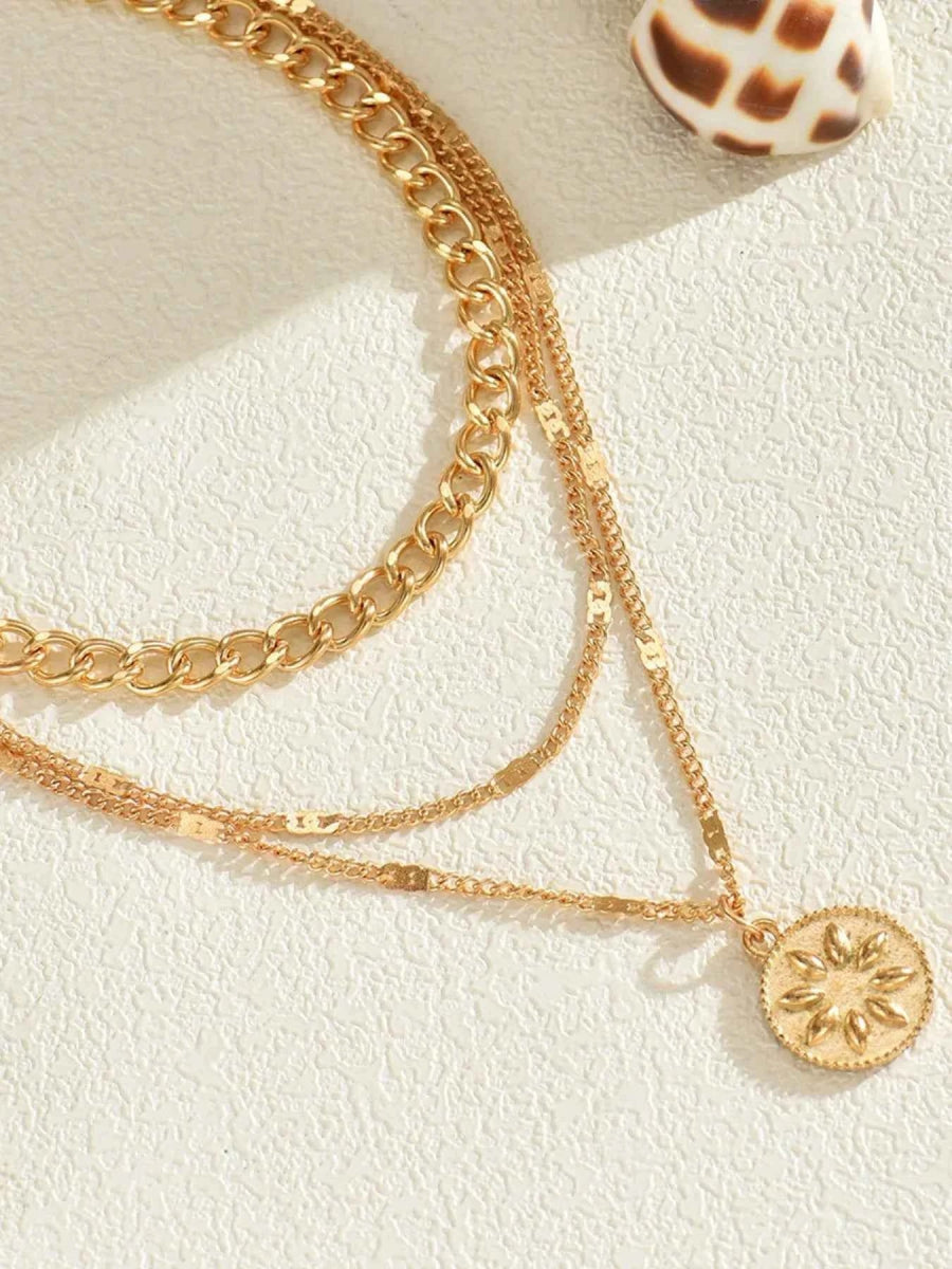 18K Gold-Plated Layered Necklace with Sun Medallion Pendant.