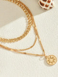 18K Gold-Plated Layered Necklace with Sun Medallion Pendant.
