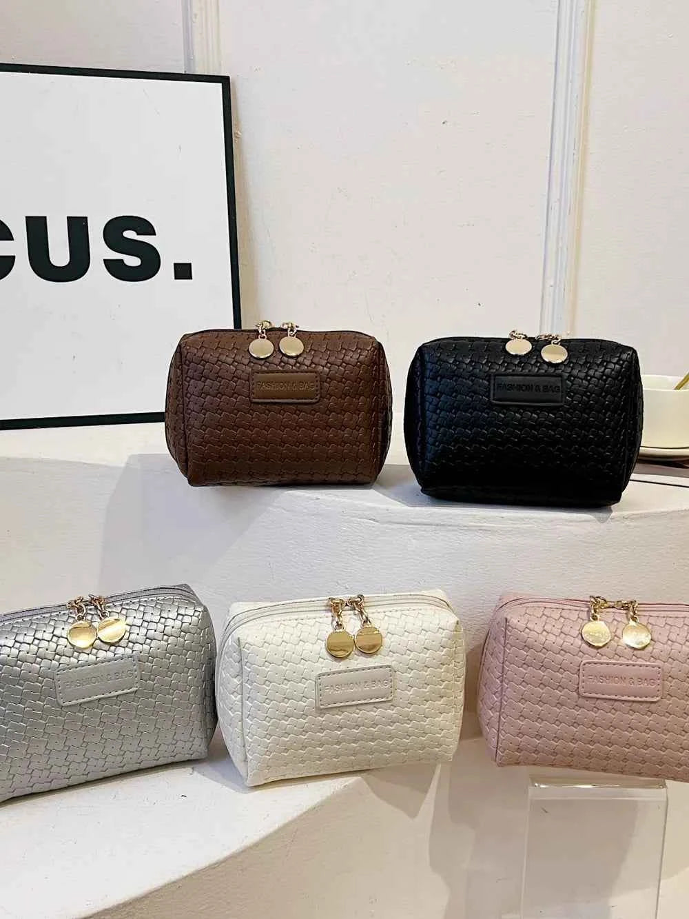 PU Leather Woven Clutch Bag.