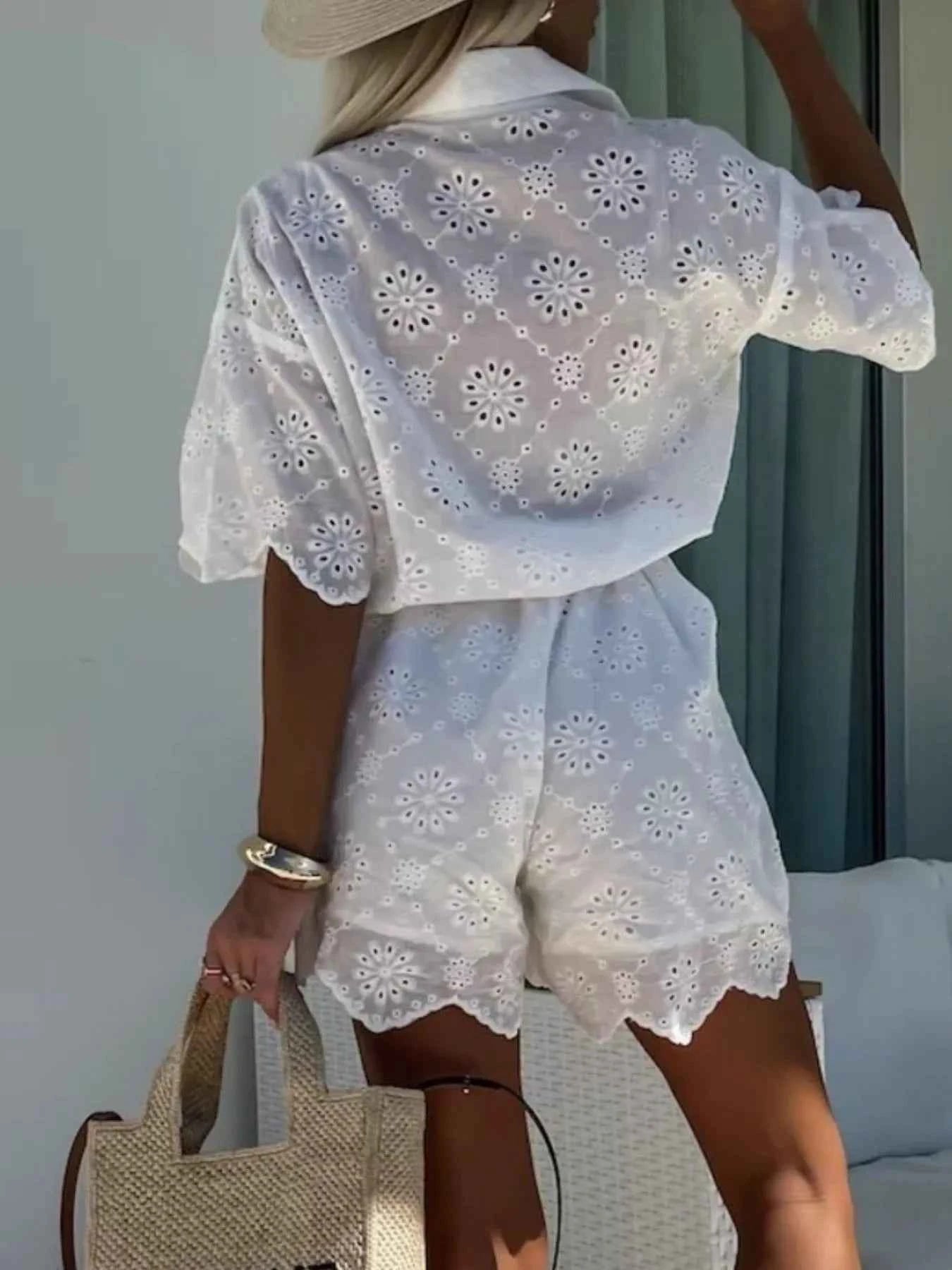 Eyelet Lace Button-Up Romper.