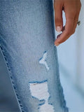 Distressed High-Waisted Skinny Jeans.
