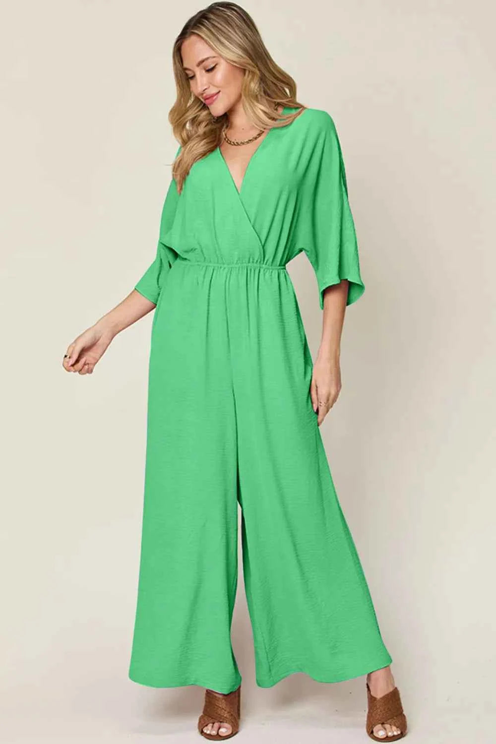 Double Take Full Size Surplice Wide Leg Jumpsuit with Pockets.