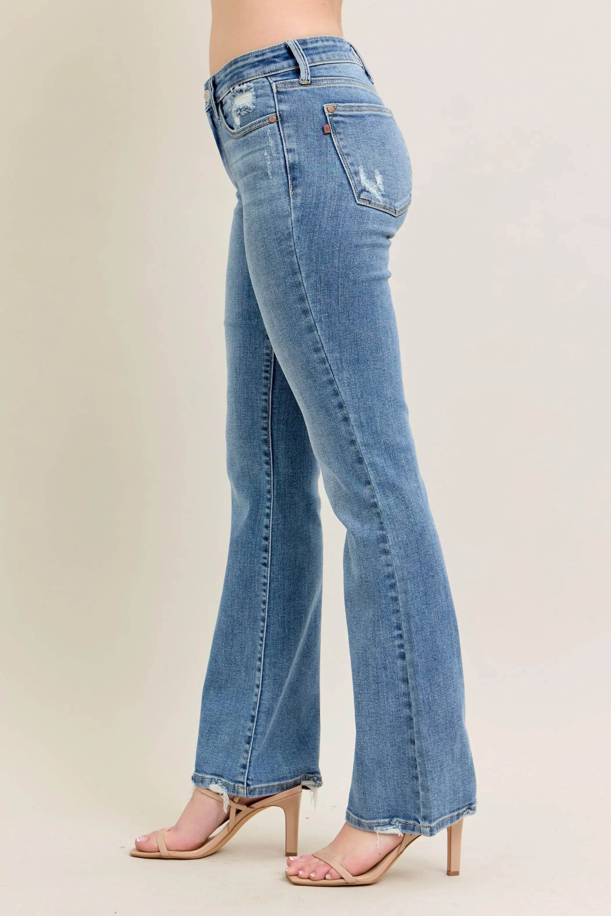 Judy Blue Plus Size Mid Rise Bootcut Jeans with Destroyed Hem.