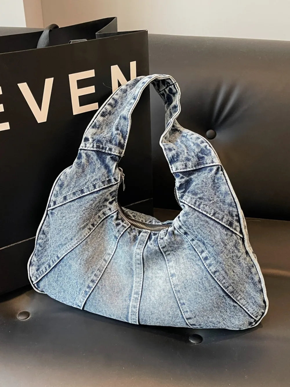 Crescent Shaped Denim Shoulder Bag.