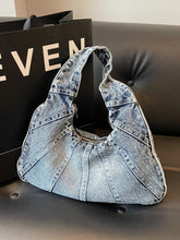 Crescent Shaped Denim Shoulder Bag.