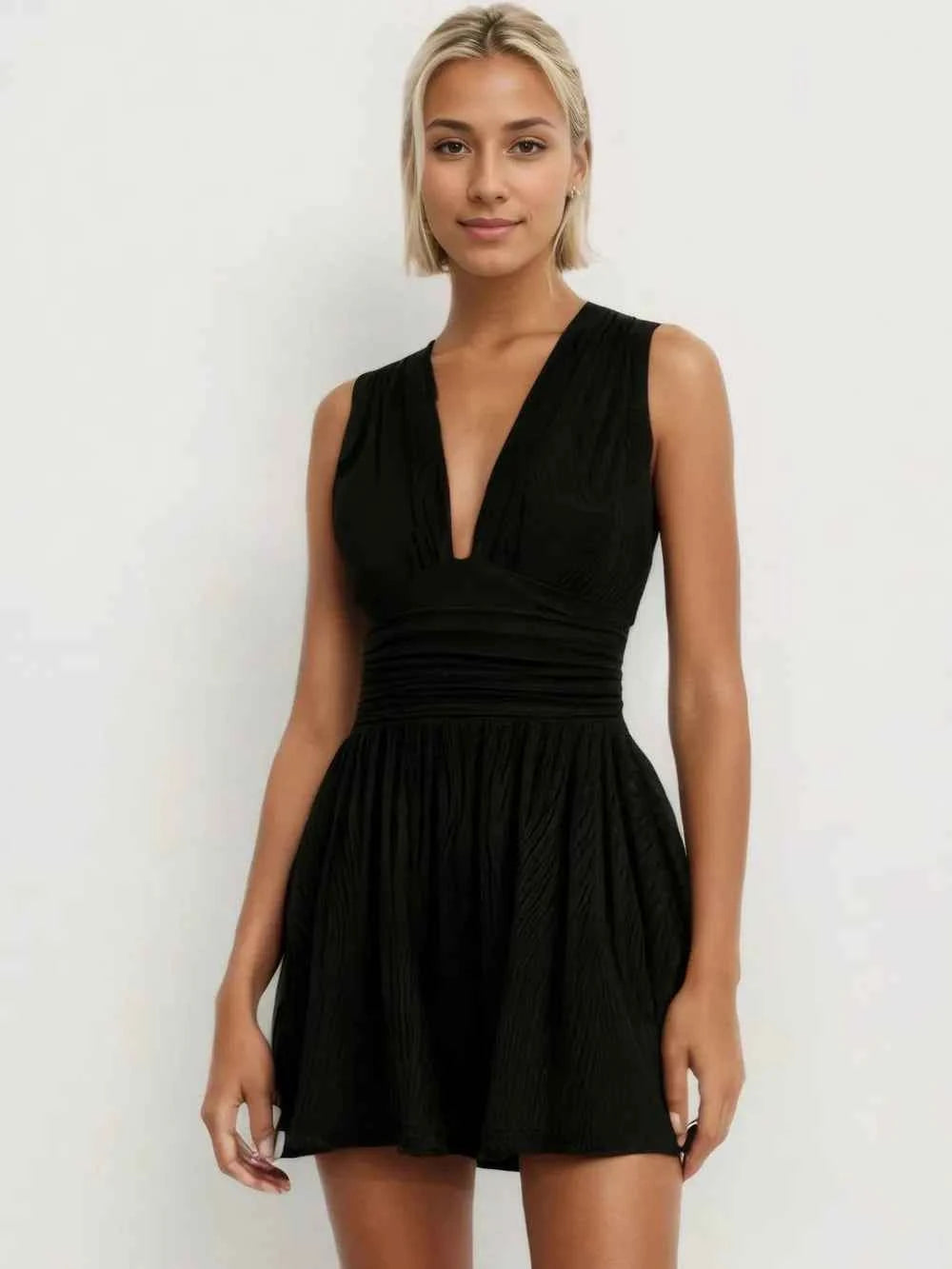 Ruched Plunge Sleeveless Romper.