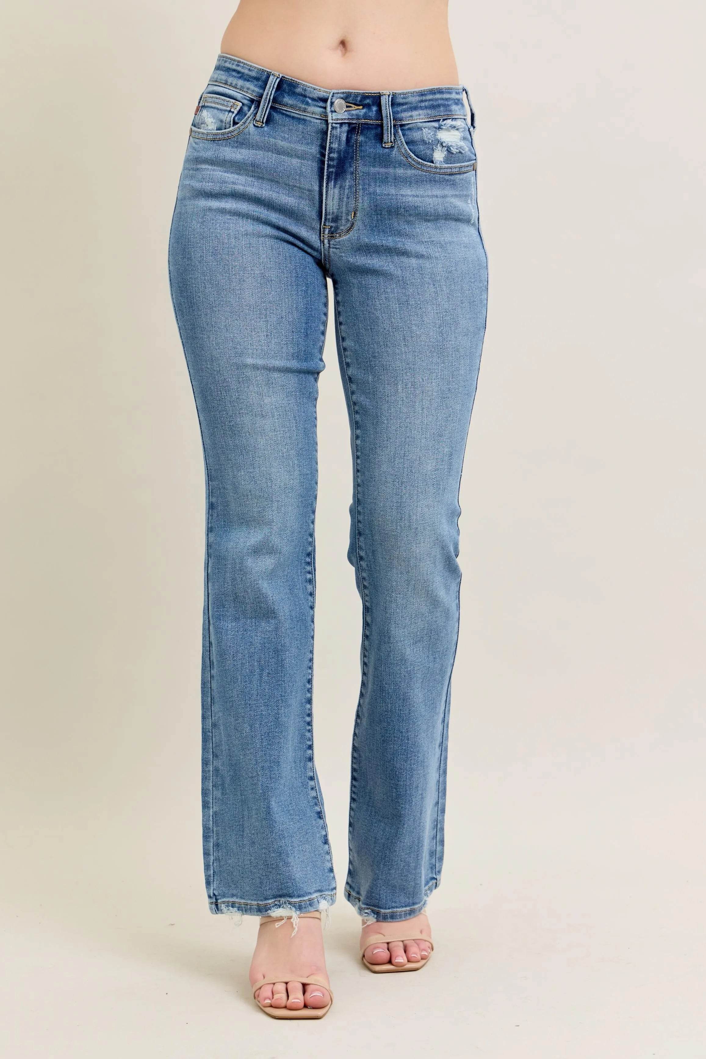 Judy Blue Plus Size Mid Rise Bootcut Jeans with Destroyed Hem.