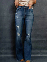 Distressed High-Waisted Flare Jeans.