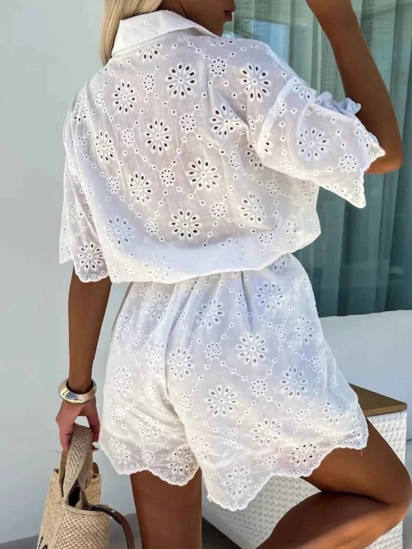 Eyelet Lace Button-Up Romper.