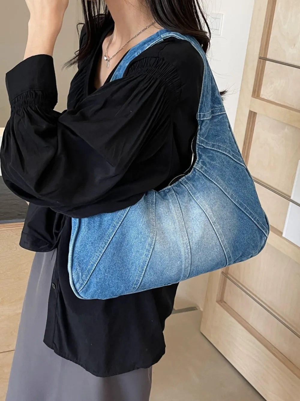 Crescent Shaped Denim Shoulder Bag.