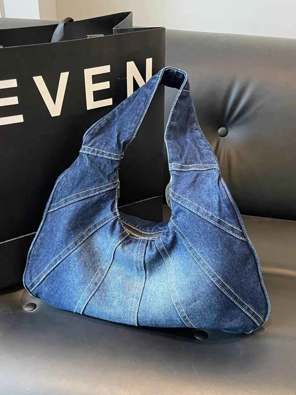 Crescent Shaped Denim Shoulder Bag.