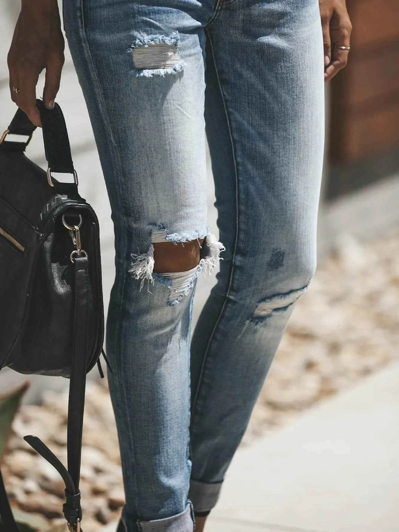 Distressed Button-Fly Skinny Jeans.