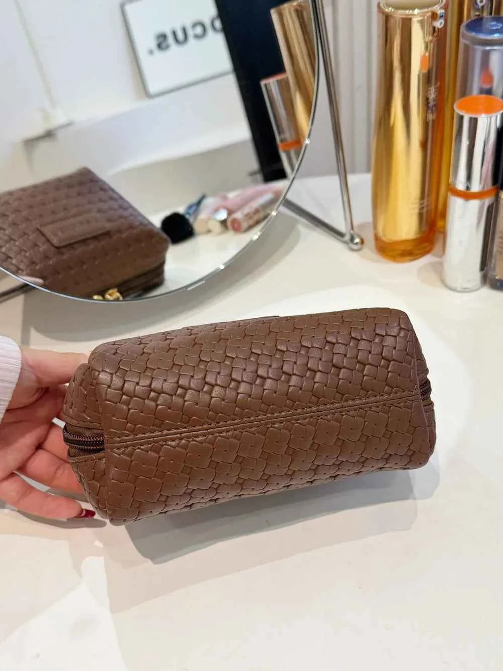 PU Leather Woven Clutch Bag.