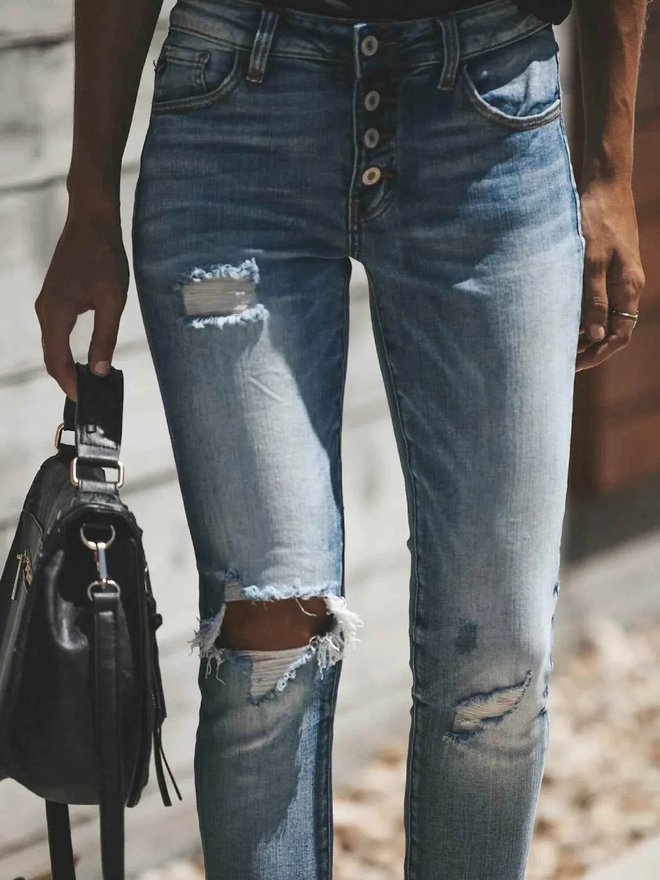 Distressed Button-Fly Skinny Jeans.