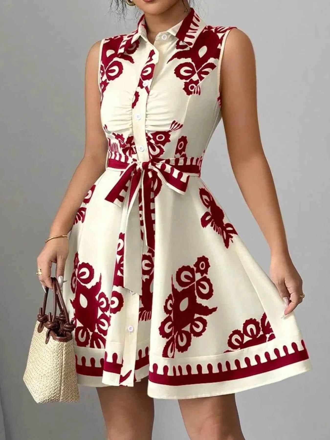 Printed Sleeveless Tie Waist Mini Dress.