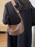 Stylish Leather Shoulder Bag with Woven Strap.