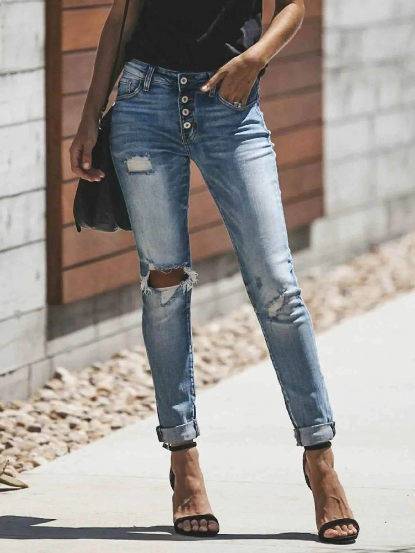 Distressed Button-Fly Skinny Jeans.