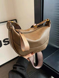 Stylish Leather Shoulder Bag with Woven Strap.