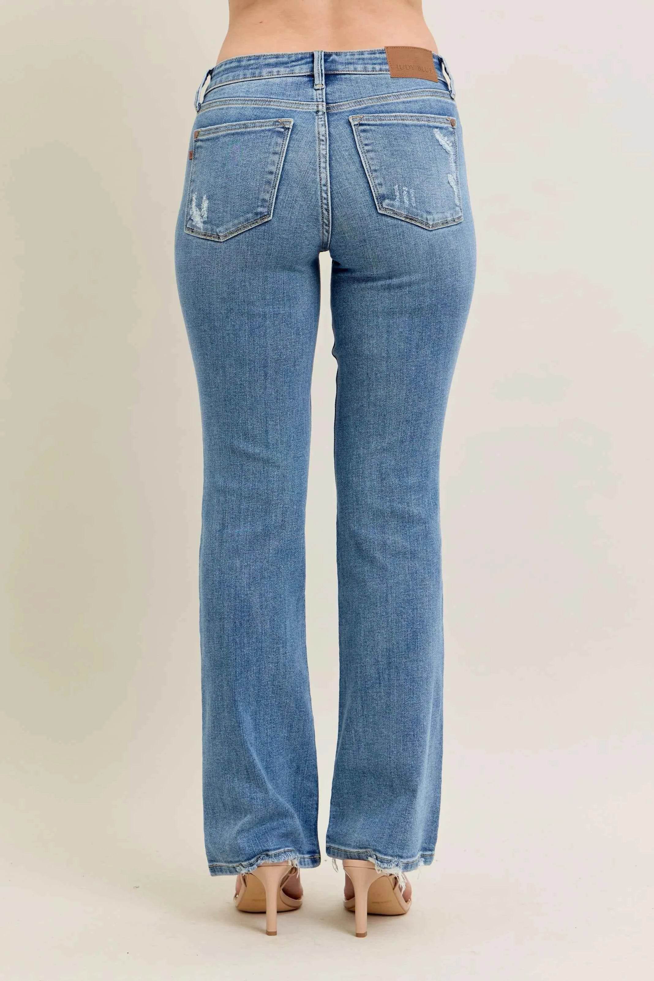 Judy Blue Plus Size Mid Rise Bootcut Jeans with Destroyed Hem.