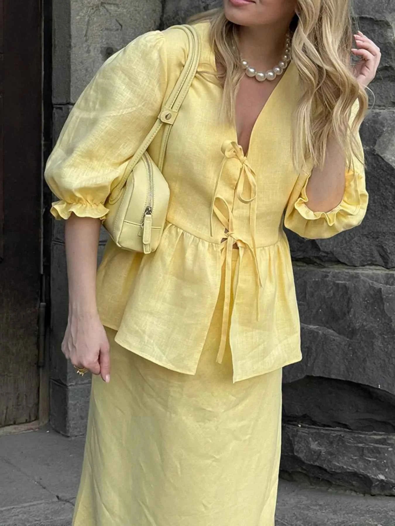 Lace-Up Tie Front Peplum Top and Skirt Set.