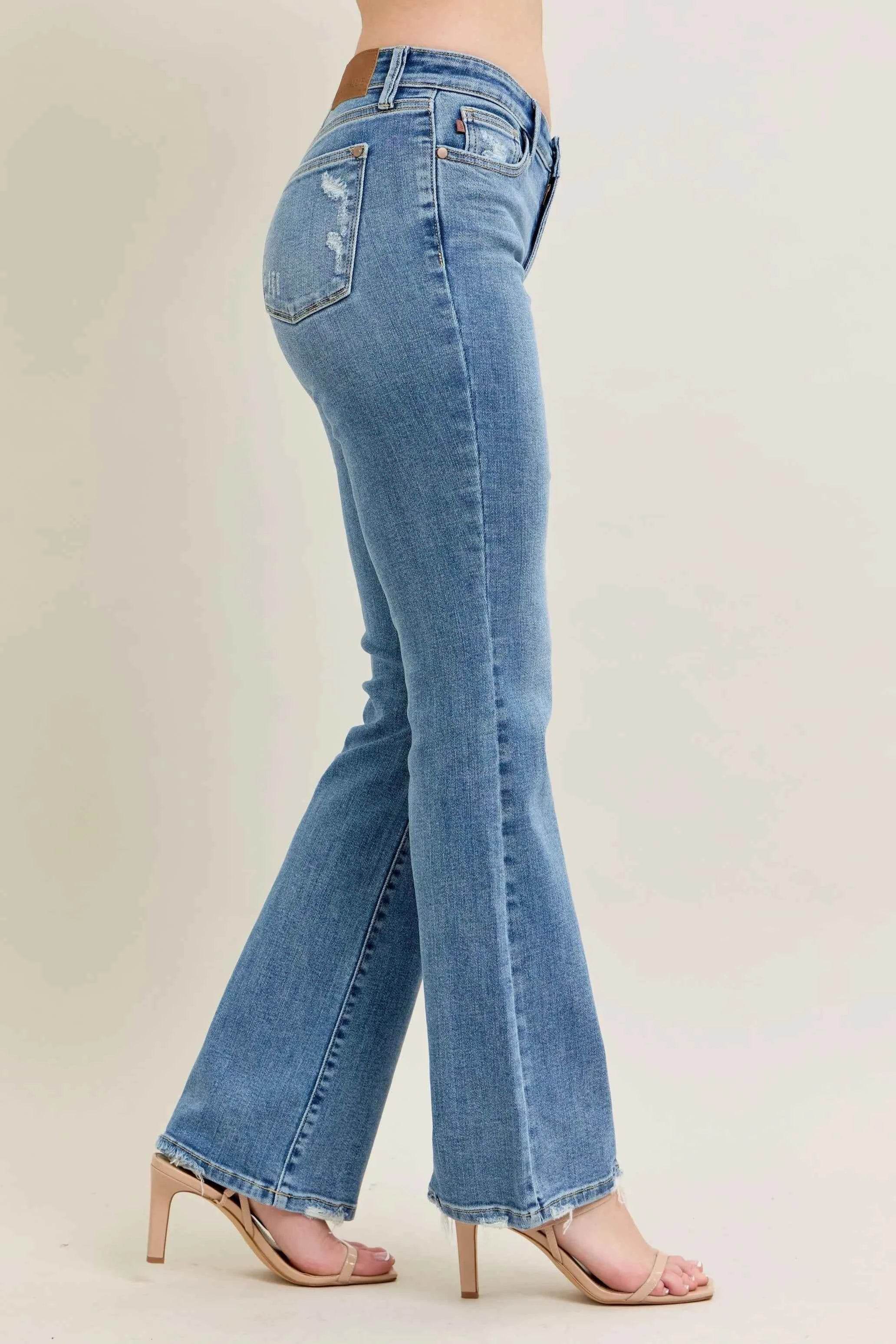 Judy Blue Plus Size Mid Rise Bootcut Jeans with Destroyed Hem.