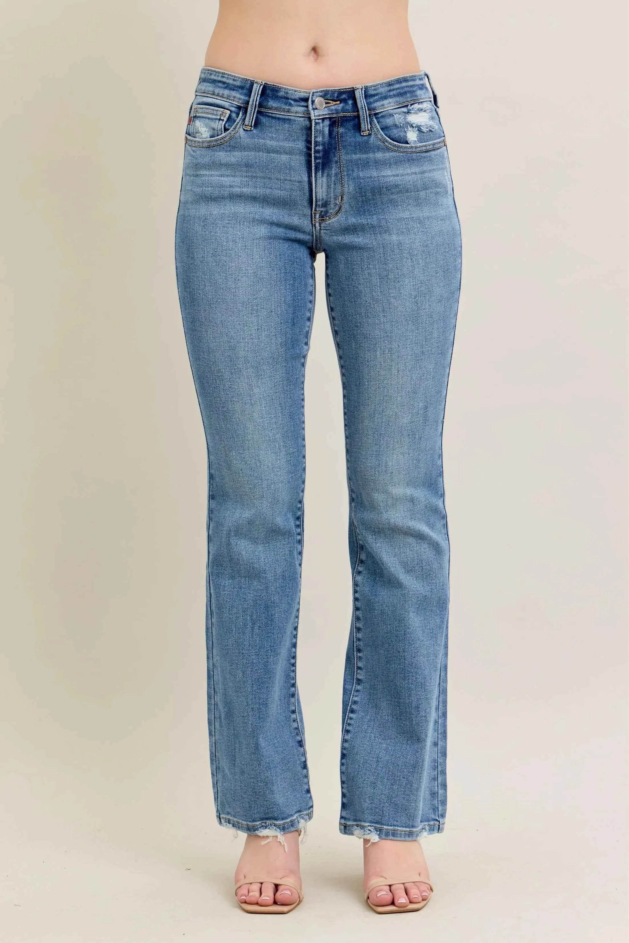 Judy Blue Plus Size Mid Rise Bootcut Jeans with Destroyed Hem.