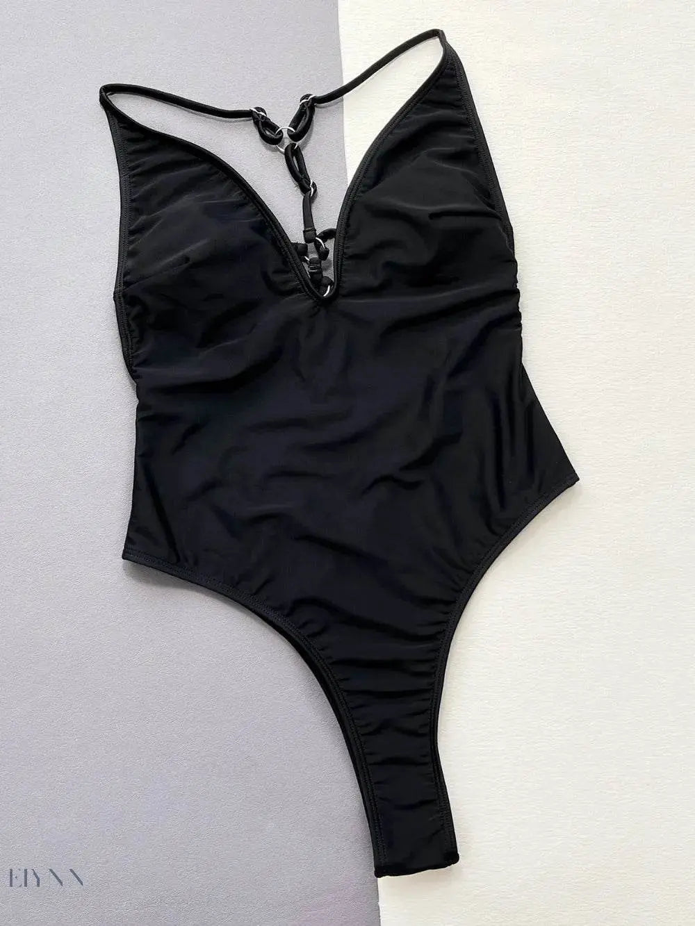 Trendsi Black spaghetti strap swimwear with deep V-neck and ruching at the sides