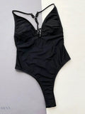 Trendsi Black spaghetti strap swimwear with deep V-neck and ruching at the sides