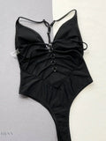 Trendy black spaghetti strap swimwear with stylish ruched detailing and a flattering cut
