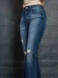 Distressed High-Waisted Flare Jeans.