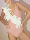 Stylish contrast flower one-piece swimsuit in pink featuring elegant flower details on the side