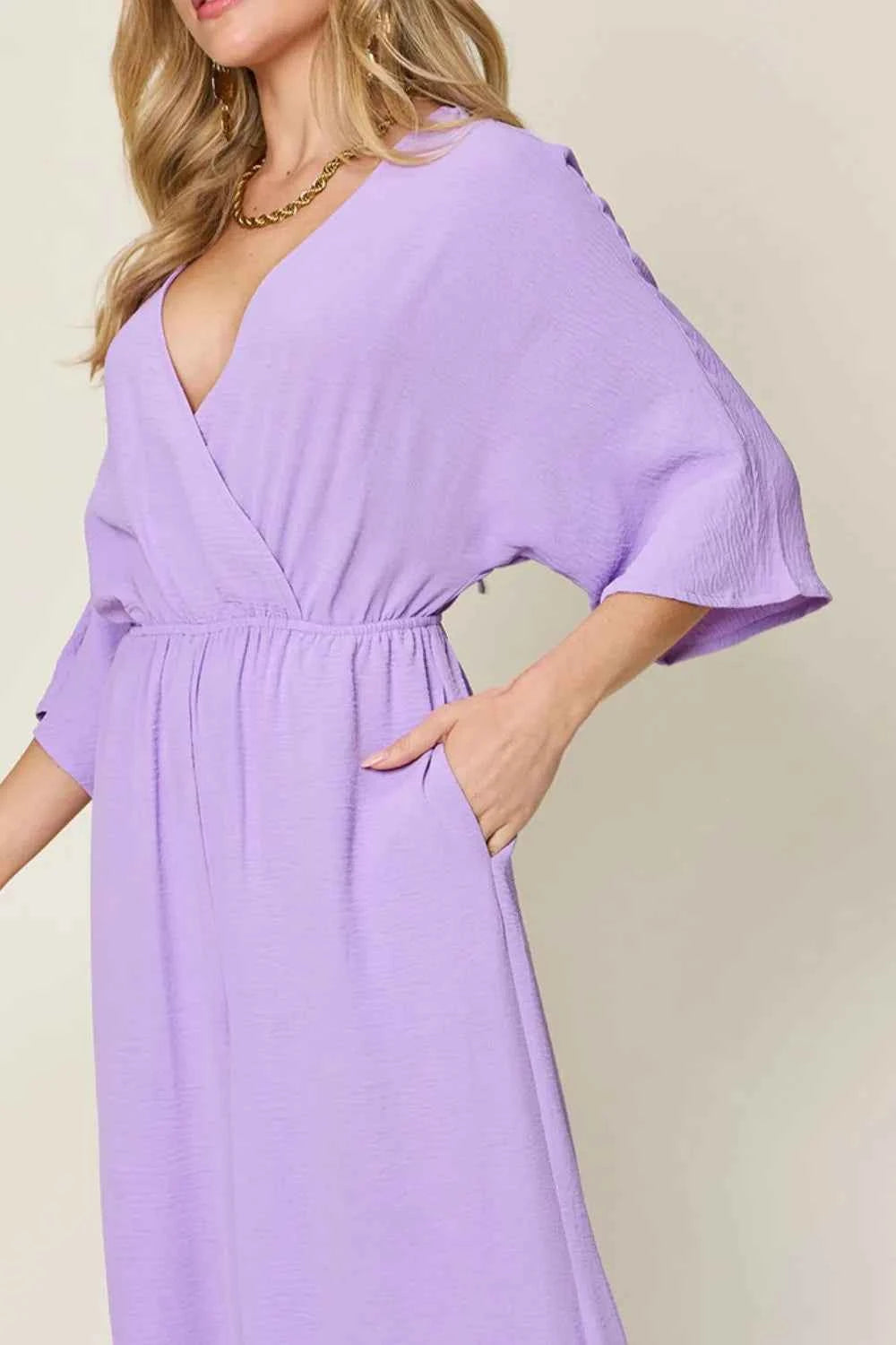 Double Take Full Size Surplice Wide Leg Jumpsuit with Pockets.