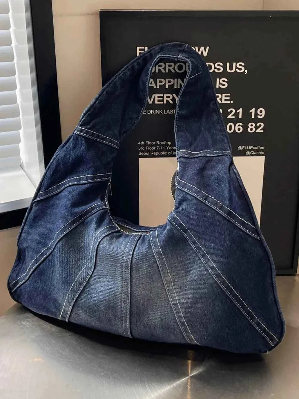 Crescent Shaped Denim Shoulder Bag.
