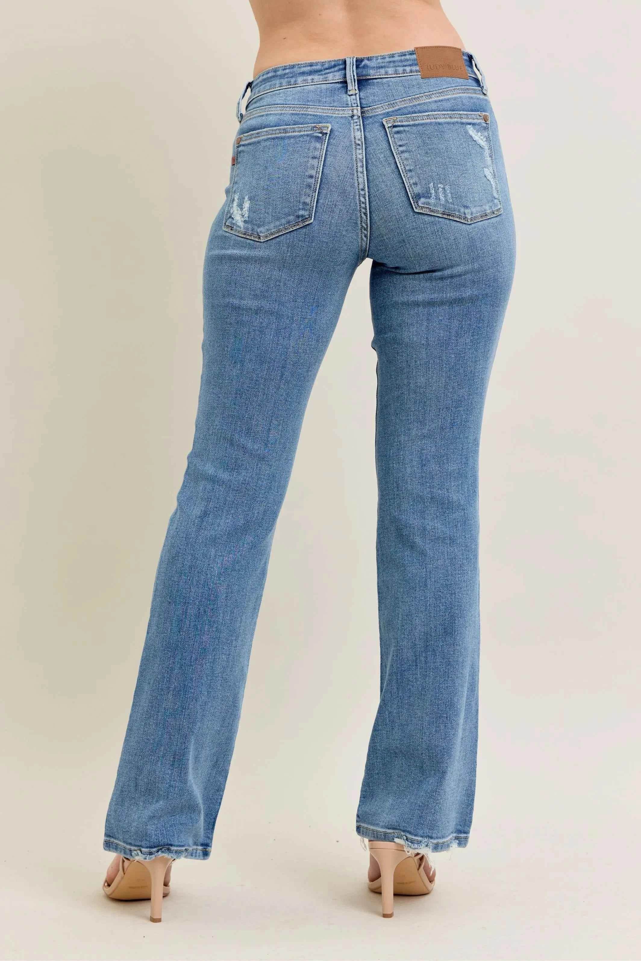 Judy Blue Plus Size Mid Rise Bootcut Jeans with Destroyed Hem.