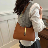 Small Leather Shoulder Bag with Gold Accent.