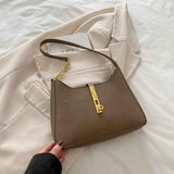 Small Leather Shoulder Bag with Gold Accent.