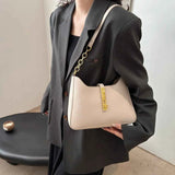 Small Leather Shoulder Bag with Gold Accent.