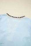 Trendy light blue puff sleeve blouse with leopard trim neckline and contrast detail leopard trim puff sleeve blouse