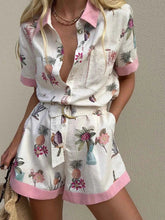 Printed Short Sleeve Romper with Belt.
