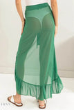 Green ruffle trim sarong skirt featuring a sheer design and flowing silhouette for beachwear