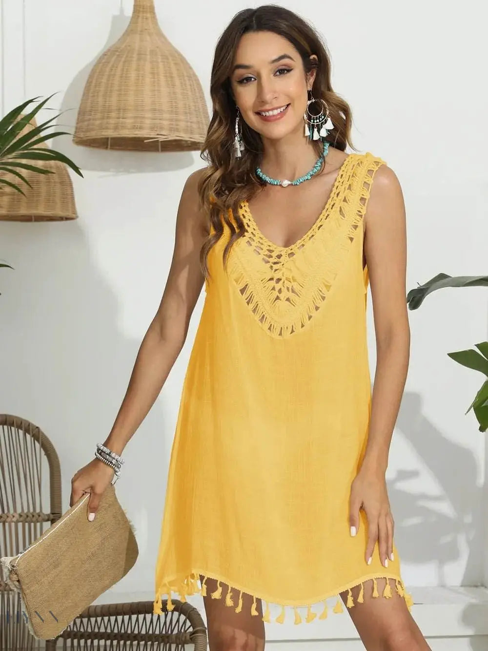 Bright yellow tassel scoop neck cover-up with intricate detailing and tassel hem for beachwear