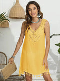 Bright yellow tassel scoop neck cover-up with intricate detailing and tassel hem for beachwear