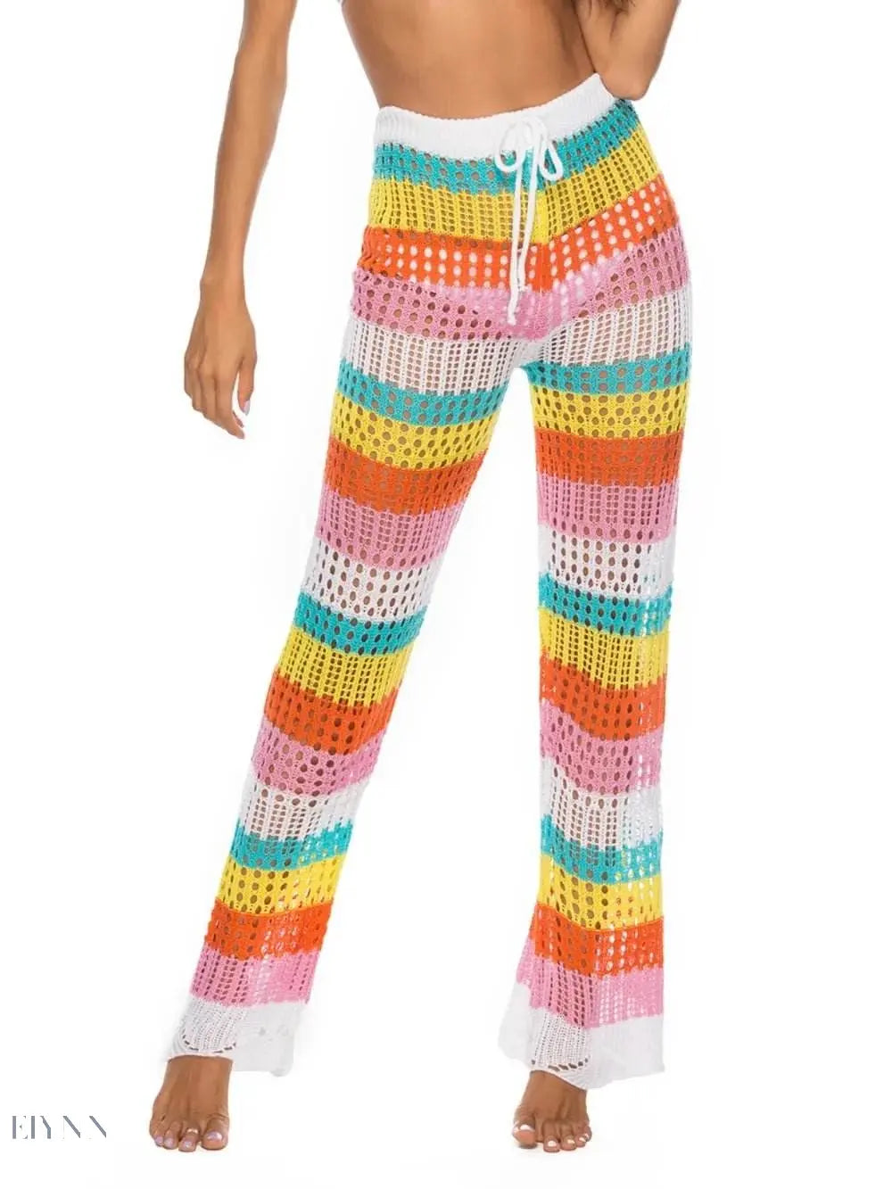 Trendy women's colorful resort wear crochet pants with vibrant stripes for beach or vacation styling