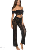 Trendy women's drawstring beach pants in black with a stylish crochet design for summer outings