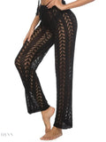 Trendy black women's drawstring beach pants with lace detailing for a stylish beach look
