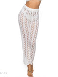 Trendy women's drawstring beach pants in white with a lightweight, breathable design for summer outings